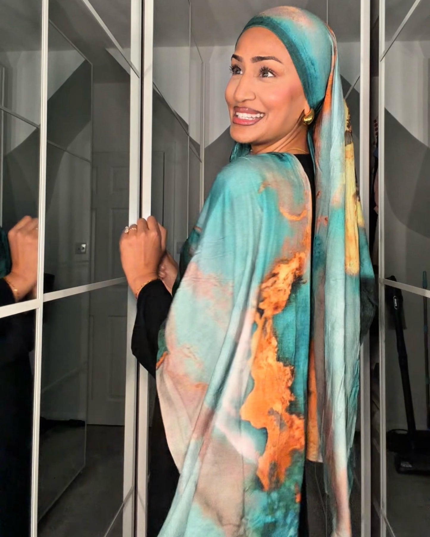 Premium Jersey Volcano Teal hijab draped elegantly, showcasing rich teal color and soft jersey fabric texture.